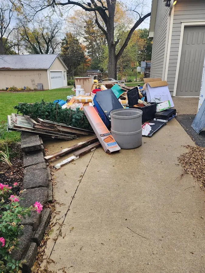 Dumpster being loaded with debris for 3 Yard Dumpster Rental in Lake Forest